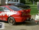 red acura with custom side graphics